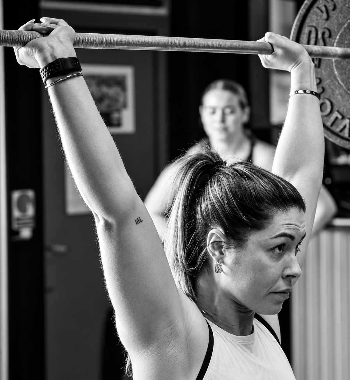 Weightlifter holding a barbell overhead